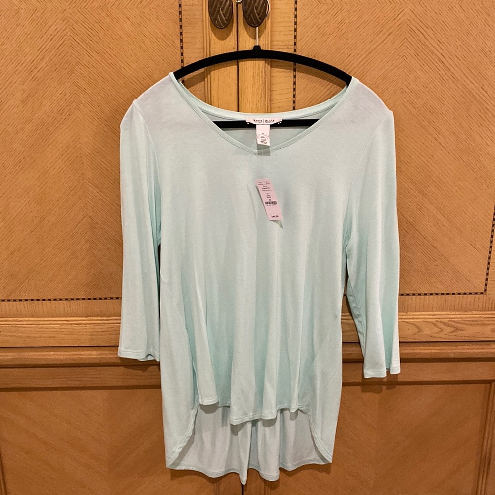 Mint colored long sleeve top.